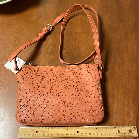 LC Lauren Conrad Handbags - Lauren Conrad crossbody purse. NWT. See pics for cut out design on one side only